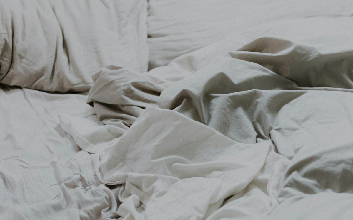 White pillows and bed comforter