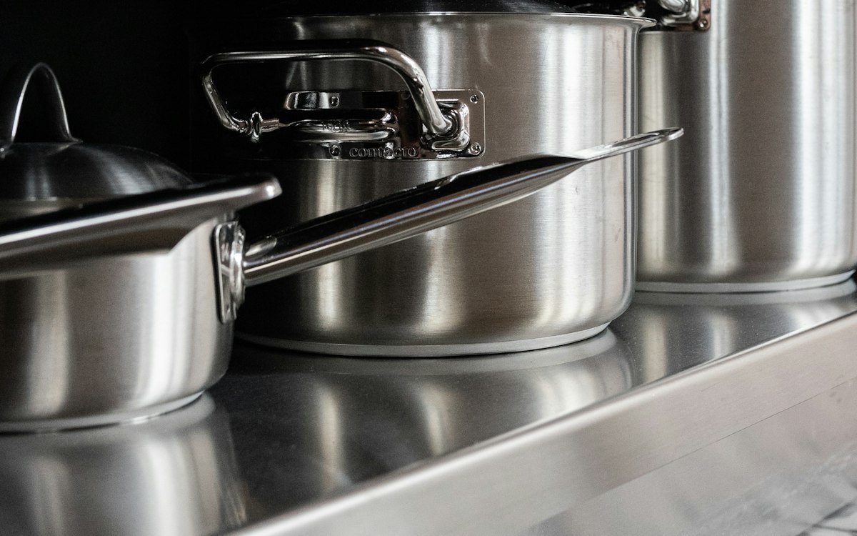 Stainless steel cooking pots on stainless steel tray